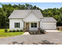 Charming front view of a two-story home with an inviting front porch and meticulously landscaped yard at 529 N Central Ave, Locust, NC 28097