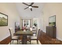 Hardwood floors throughout open concept living room and dining area with neutral tones at 703 Dalebrook Ln, Rock Hill, SC 29730