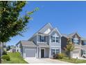 Two story home with light siding, garage, and a well manicured front lawn on a beautiful sunny day at 12548 Gotland Rd # 327, Midland, NC 28107