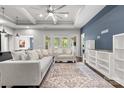 Bright, open living room with tray ceilings, hardwood floors, and French doors leading to the outdoors at 18568 Mainsail Ct, Lancaster, SC 29720
