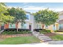 Charming townhome with a well-manicured lawn and mature trees, situated in a peaceful community at 2726 Tranquil Oak Pl, Charlotte, NC 28206