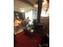 Cozy living room featuring a fireplace and exposed brick wall at 3913 Stough Sw Rd, Concord, NC 28027