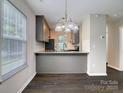 Eat-in kitchen featuring gray cabinets, a white backsplash, and gray countertops with stainless appliances at 3919 Briarhill Dr, Charlotte, NC 28215