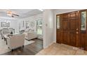 Inviting living room featuring new flooring, natural light, and a stylish entryway with a wooden door at 3943 Peggy Ln, Mint Hill, NC 28227