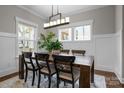 Bright dining room with natural light, a wooden table, seating for six, and stylish decor at 423 Solomon St, Charlotte, NC 28216