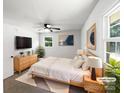 Staged bedroom with a ceiling fan, decorative wall art, stylish furniture, and carpet at 4903 Jamee Dr, Gastonia, NC 28056