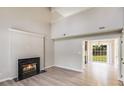 Bright living room featuring vaulted ceilings, a cozy fireplace, and an open layout perfect for entertaining at 5417 Timbertop Ln, Charlotte, NC 28215