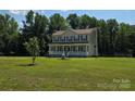 Beautiful two-story home featuring a covered front porch and a large grassy yard at 550 Baker Mill Rd, Cleveland, NC 27013