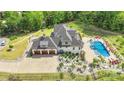 Gorgeous home featuring a backyard oasis with a pool, patio, and a well-maintained three-car garage at 1430 Rosehill Dr, Waxhaw, NC 28173