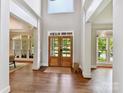 Bright foyer showcasing hardwood floors, modern lighting, and open layout at 18618 Rollingdale Ln, Davidson, NC 28036