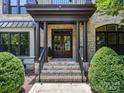 Grand entrance with double doors and brick columns creating a lasting first impression at 18618 Rollingdale Ln, Davidson, NC 28036
