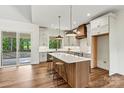 Well-appointed kitchen featuring a spacious island, stainless steel appliances, and modern lighting at 252 Teeter Rd, Mooresville, NC 28115