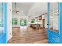 Bright, open-concept kitchen with a large island, hardwood floors, and modern appliances at 252 Teeter Rd, Mooresville, NC 28115