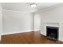 Neutral living room features hardwood floors, white trim and black fireplace at 308 Davis Park Rd, Gastonia, NC 28052