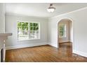 Sun-filled living room featuring hardwood floors, and white trim at 308 Davis Park Rd, Gastonia, NC 28052