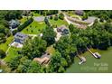 Aerial view of the house near the lake and other homes at 313 Sunset View Ct, York, SC 29745