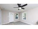 Bright living room featuring updated flooring, fresh paint, modern ceiling fan, and natural light at 426 Williamson St, Rock Hill, SC 29730