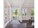 Bright foyer with hardwood floors, white trim, and an open view of the outdoors at 500 Landau Rd, Waxhaw, NC 28173