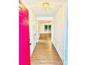 Bright entryway with wood floors, fresh paint, and views into the open living space at 7215 Wingstone Ln, Charlotte, NC 28262