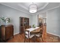Stylish dining area with wood floors, designer lighting, and ample natural light at 918 Kite Dr, Fort Mill, SC 29715