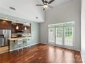 Open concept living with bar seating and French doors at 1326 Anthem Ct, Charlotte, NC 28205