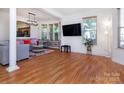 Bright and open living room featuring beautiful hardwood floors and lots of natural light at 2273 Aston Mill Pl, Charlotte, NC 28273