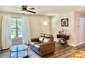 Bright living room with natural light, modern flooring, and a cozy seating area perfect for relaxation at 2921 Heavners Farm Ct, Lincolnton, NC 28092