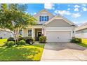 Charming home with a well-manicured lawn, tree and two-car garage at 3835 Norman View Dr, Sherrills Ford, NC 28673