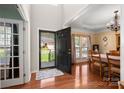 Welcoming entryway with hardwood floors leading to a dining area and office space at 512 Veloce Trl, Fort Mill, SC 29715