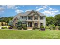 Charming home featuring stone accents, a landscaped front yard, and inviting curb appeal at 7805 Crooked Creek Church Rd, Monroe, NC 28110