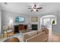 Cozy living room with a fireplace, comfortable seating, and ample natural light creating a welcoming atmosphere at 8232 Sunset Hill Rd # Th88, Waxhaw, NC 28173