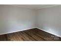 Neutral bedroom showcasing modern, wood-look flooring and fresh paint at 824 6Th Nw St # 5, Hickory, NC 28601
