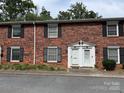 Close-up of brick townhome exterior, showcasing dual entrances and black shutters at 824 6Th Nw St # 5, Hickory, NC 28601