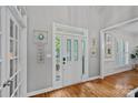 Bright foyer with hardwood floors, white trim, and decorative wall art creates an inviting entrance at 9427 Gilpatrick Ln # 5, Huntersville, NC 28078