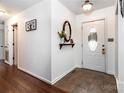 Bright entryway featuring tile flooring, an oval mirror, and decor details at 958 Hillard Ln, Lincolnton, NC 28092