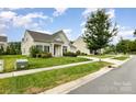 Well-maintained single-story home on a green lawn, showcasing its neat landscaping and inviting curb appeal at 1116 Arnott Ln, Matthews, NC 28105