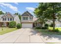 Charming two-story home with a two-car garage, brick accents, and well-manicured landscaping at 13510 Brandon Trail Dr, Charlotte, NC 28213