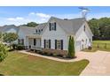 Stunning single-Gathering home with a two-car garage and well-maintained lawn at 152 Riverstone Dr, Davidson, NC 28036