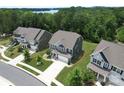 An aerial shot showcasing the house, complemented by manicured lawns and tree-lined streets in a vibrant neighborhood at 17718 Terryglass Ln, Charlotte, NC 28278