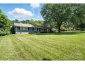 Well-maintained home with a spacious, green lawn and lush landscaping at 188 Gum Branch Rd # 3, Charlotte, NC 28214