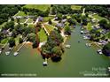 Breathtaking aerial view of waterfront property featuring mature trees and approximately 300' shoreline at 188 Ponderosa Cir, Mooresville, NC 28117