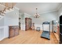 Spacious living room with hardwood floors, wainscotting, and chandelier at 2014 Steeplechase Dr, Rock Hill, SC 29732