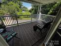 Inviting covered back porch with comfortable seating, perfect for relaxation and outdoor enjoyment at 204 Brentwood Dr, Maiden, NC 28650