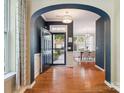 Stunning foyer featuring a grand archway, gleaming hardwood floors, and an inviting, light-filled entryway at 2545 Chasewater Dr, Fort Mill, SC 29707