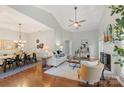 Spacious living room features hardwood floors, and adjacent dining area, perfect for entertaining at 3212 Ashwell Oaks Ln, Matthews, NC 28105