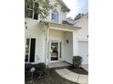 Inviting front entrance with a glass door, stylish sidelights, and classic white trim details at 3617 Betterton Ln, Charlotte, NC 28269