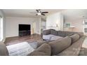 Spacious living room with hardwood floors, fireplace, and lots of natural light at 394 Link Dr, Iron Station, NC 28080