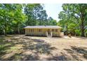 Charming one-story home with a brick exterior, neat landscaping, and well-maintained front yard at 402 Gibson Park Dr, Huntersville, NC 28078