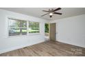 Bright living room with new floors, ceiling fan, and fresh paint with nice natural light at 402 Gibson Park Dr, Huntersville, NC 28078