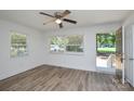 Bright living room with fresh paint and natural light, featuring new flooring and ceiling fan at 402 Gibson Park Dr, Huntersville, NC 28078